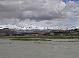 17 Cho Oyu With Monsoon Flooded Tingri Plain And Tingri Village In 2005 To the south of Tingri beyond the monsoon flooding is Cho Oyo (8201m). To Cho Oyu�s right is the Nangpa La pass (5800m) and then Jobo Rabzang. The Nangpa La pass leads from Tibet to the Solo Khumbu region of Nepal by way of Thame and Namche Bazaar. The pass is normally open only from May to August. Jobo Rabzang (6666m) has impressive rock and ice towers just northwest of Nangpa La near the border of Nepal and Tibet.